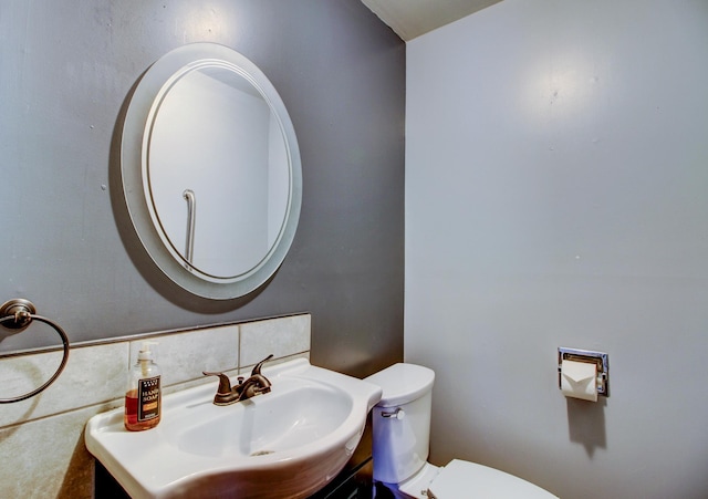 bathroom with sink and toilet