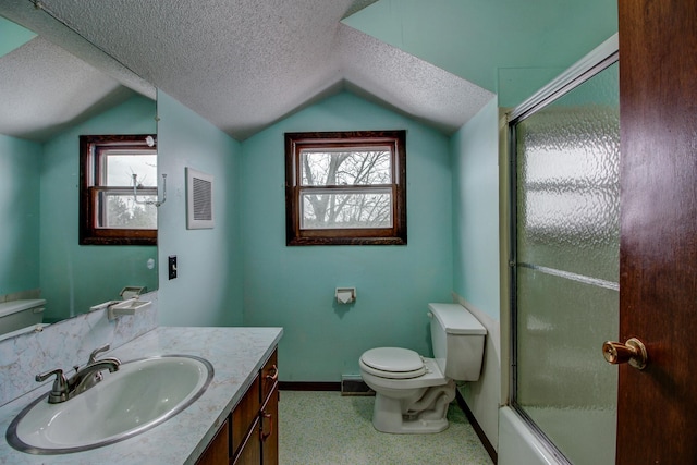 full bathroom with a textured ceiling, enclosed tub / shower combo, vaulted ceiling, and vanity