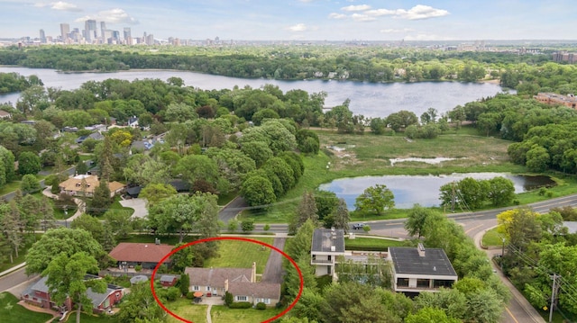 birds eye view of property with a water view