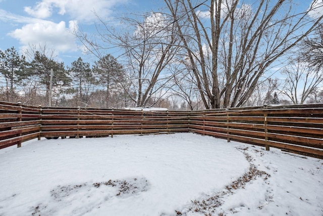 view of yard covered in snow