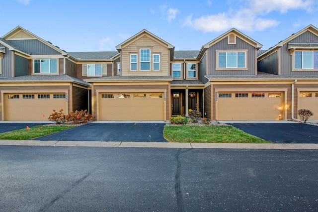 townhome / multi-family property featuring a garage