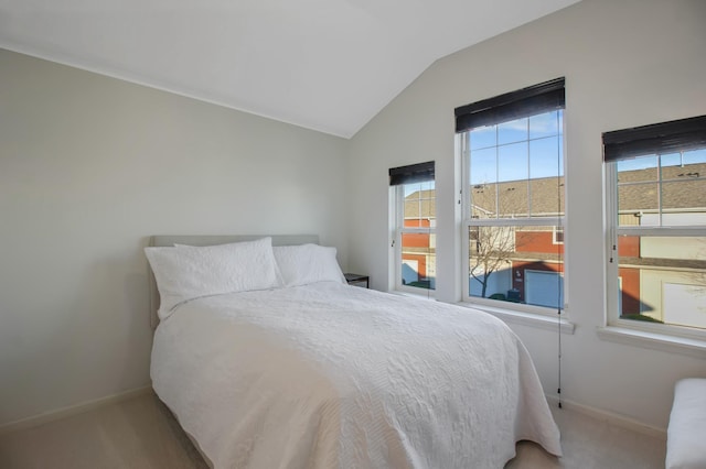 bedroom featuring carpet flooring and vaulted ceiling