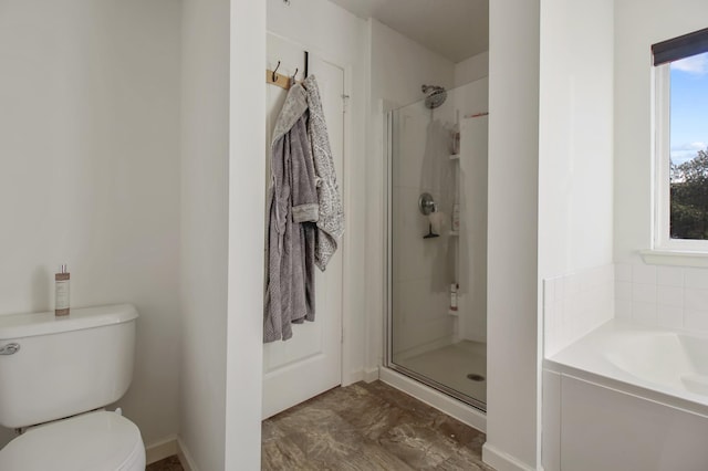 bathroom with separate shower and tub and toilet