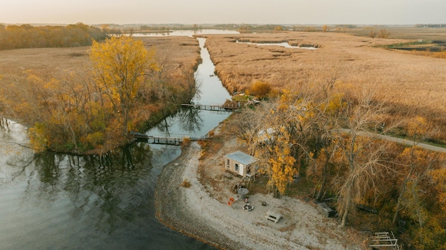 birds eye view of property with a water view and a rural view