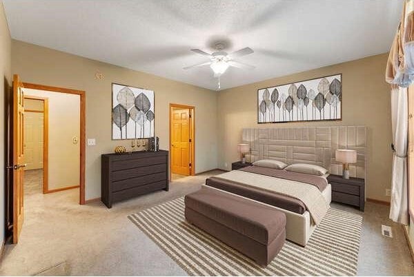 bedroom featuring ceiling fan and light colored carpet