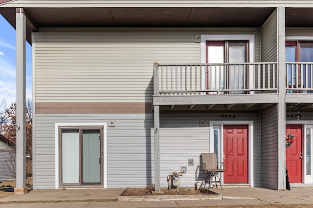 rear view of property with a balcony