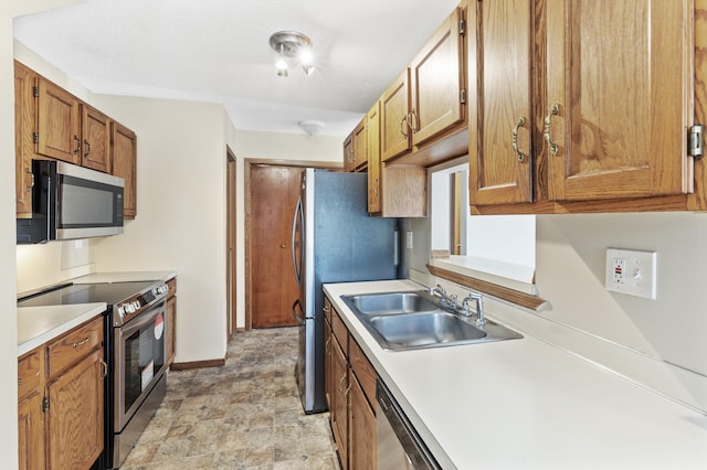 kitchen featuring appliances with stainless steel finishes and sink