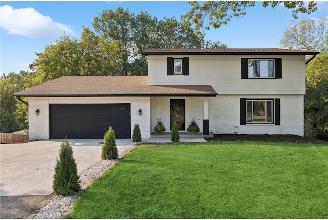 front facade with a garage and a front lawn