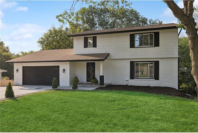 view of front property with a garage and a front yard