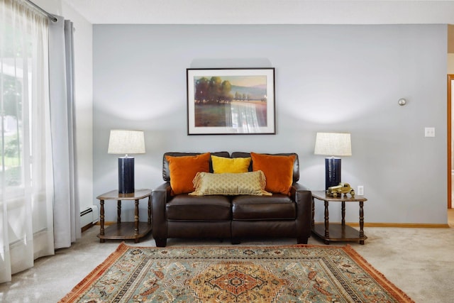 living room with carpet floors, plenty of natural light, and a baseboard heating unit