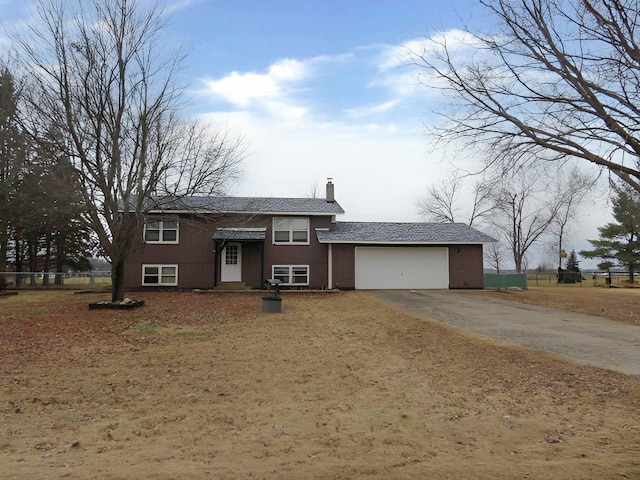 split foyer home featuring a garage