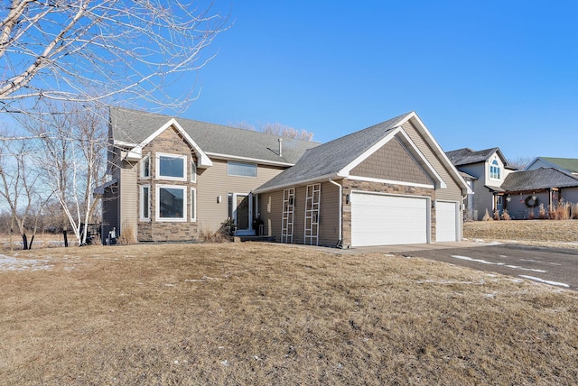 view of front facade with a garage and a front yard