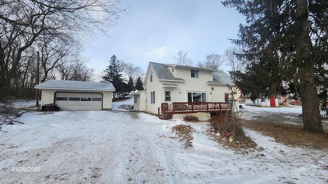 view of front of property with a garage and a deck