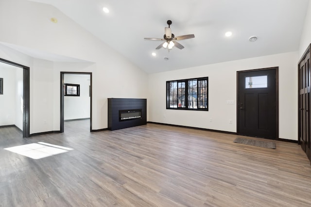 unfurnished living room with ceiling fan, light hardwood / wood-style flooring, and high vaulted ceiling