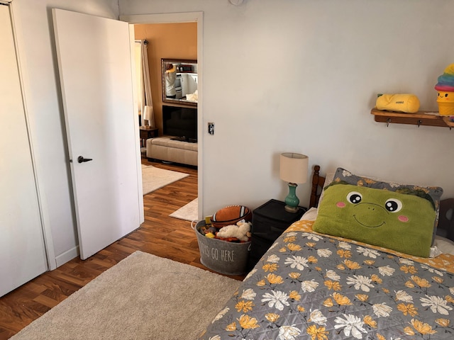 bedroom featuring dark hardwood / wood-style flooring