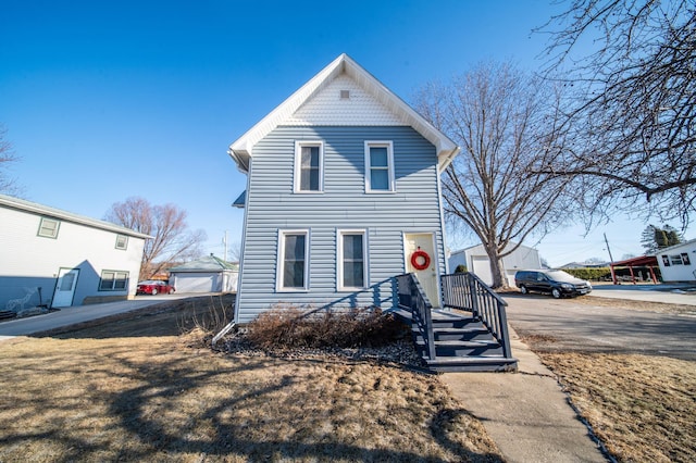 view of front of property featuring an outbuilding