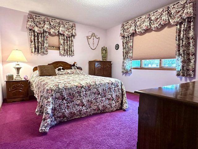 bedroom with carpet flooring and a textured ceiling