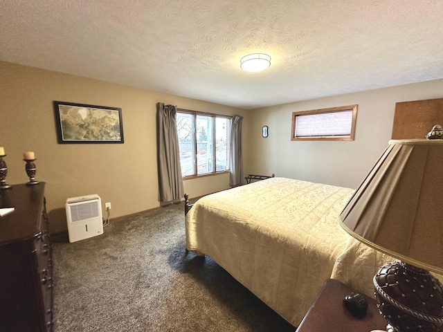 carpeted bedroom featuring a textured ceiling