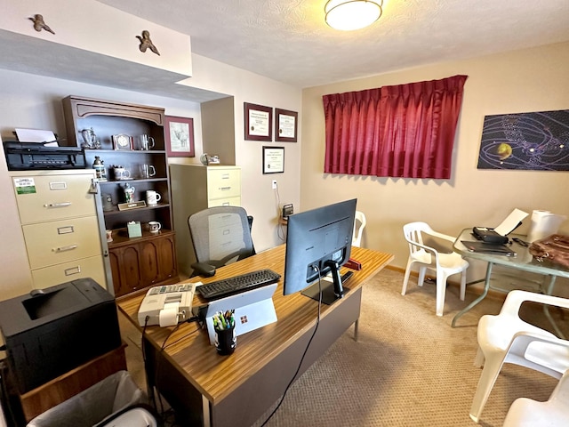 carpeted office featuring a textured ceiling