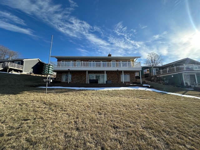 back of house featuring a yard and a deck