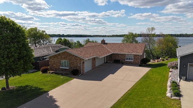 1606 Shore Dr, Worthington, MN 56187 - view of front of property featuring an attached garage, a water view, driveway, and brick siding