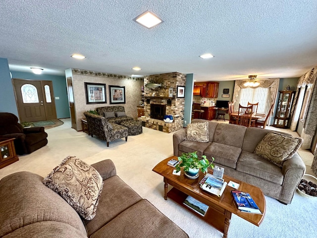 1606 Shore Dr, Worthington, MN 56187 - living area featuring light carpet, a textured ceiling, a brick fireplace, plenty of natural light, and recessed lighting