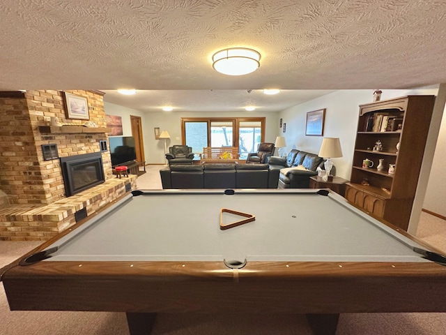 1606 Shore Dr, Worthington, MN 56187 - game room featuring billiards table, a textured ceiling, carpet flooring, and a brick fireplace