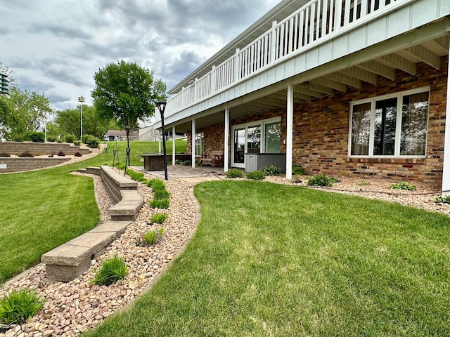 1606 Shore Dr, Worthington, MN 56187 - view of green lawn with a patio area