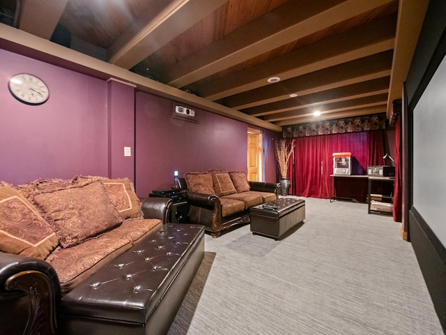 carpeted cinema room with beamed ceiling