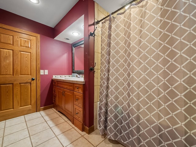 full bathroom with tile patterned flooring, vanity, and recessed lighting