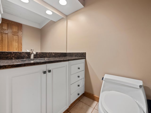 bathroom with vanity, tile patterned floors, and toilet