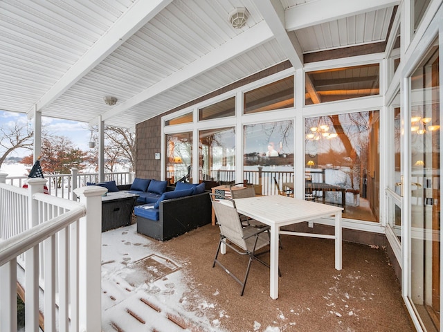 sunroom / solarium with vaulted ceiling