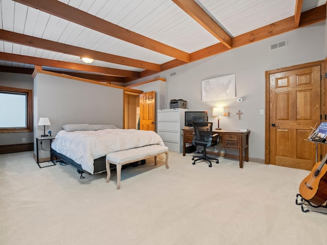 bedroom featuring beam ceiling, light colored carpet, visible vents, and baseboards