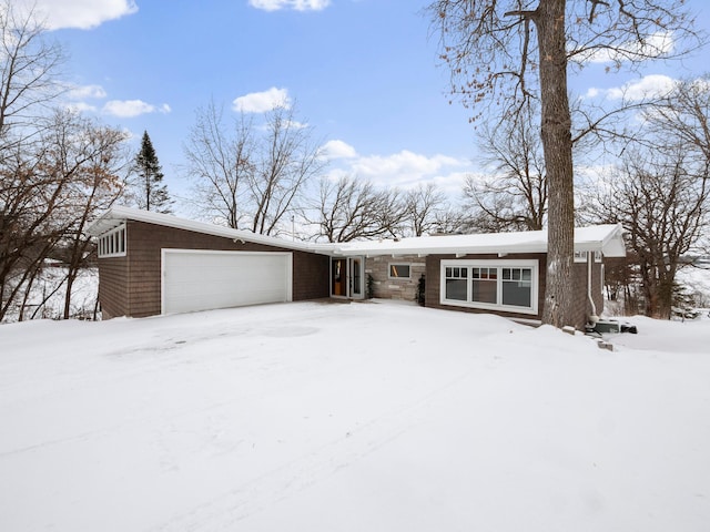 mid-century modern home with an attached garage