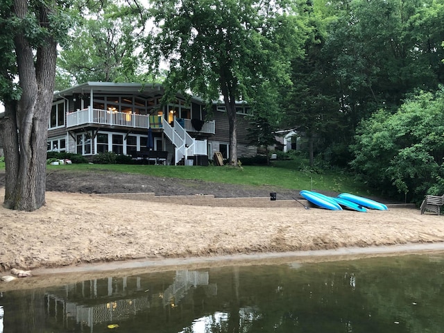 back of house featuring a water view