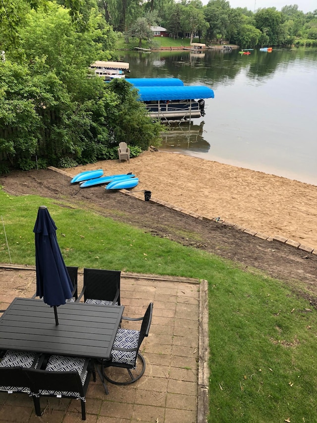 exterior space featuring a water view and a yard