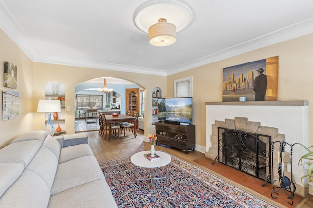 living room featuring ornamental molding and hardwood / wood-style flooring