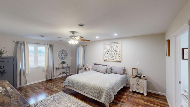 bedroom with ceiling fan and dark wood-type flooring