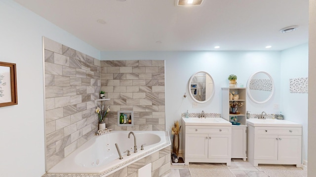 bathroom featuring vanity and a relaxing tiled tub