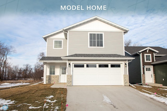 view of front property with a garage and a lawn