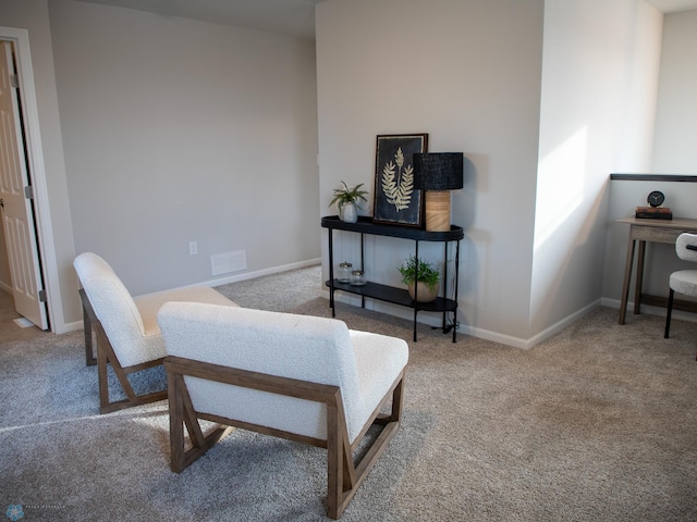 living area with carpet flooring