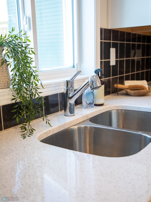 details with sink and light stone countertops