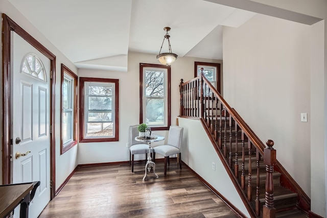 723 Lowry Ave NE, Minneapolis, MN 55418 - foyer with vaulted ceiling, wood finished floors, stairs, and baseboards