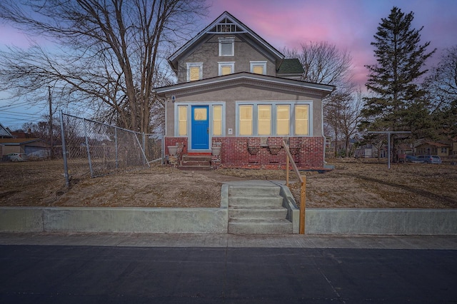 723 Lowry Ave NE, Minneapolis, MN 55418 - view of front of property with entry steps, brick siding, and stucco siding