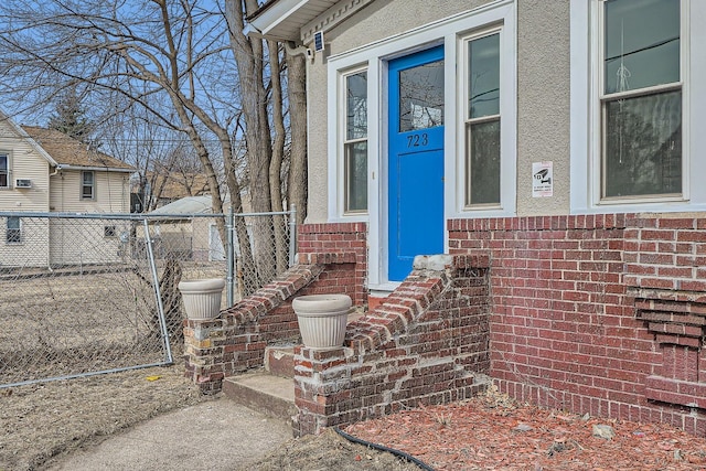 723 Lowry Ave NE, Minneapolis, MN 55418 - view of exterior entry with brick siding and stucco siding