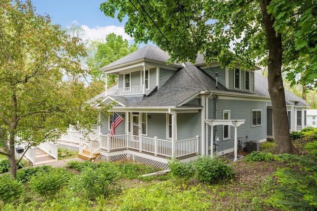 451 Everett St N, Stillwater, MN 55082 - view of front of home with a shingled roof, a porch, a balcony, and central air condition unit