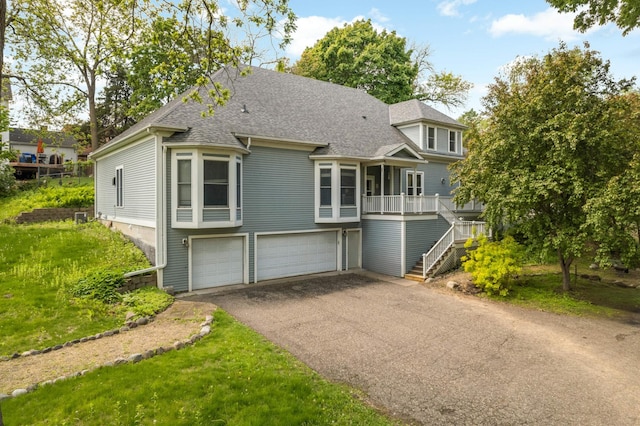 451 Everett St N, Stillwater, MN 55082 - view of front of home with stairway, a shingled roof, asphalt driveway, and a garage