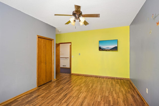 451 Everett St N, Stillwater, MN 55082 - unfurnished room featuring wood finished floors, a ceiling fan, and baseboards