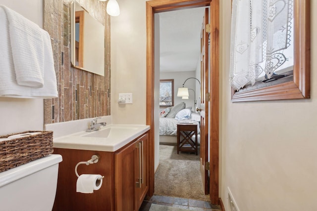 bathroom with vanity and toilet