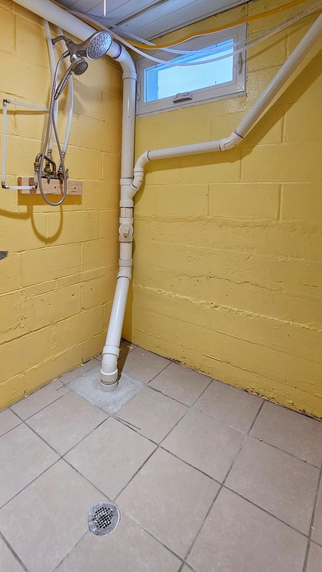 basement with tile patterned floors